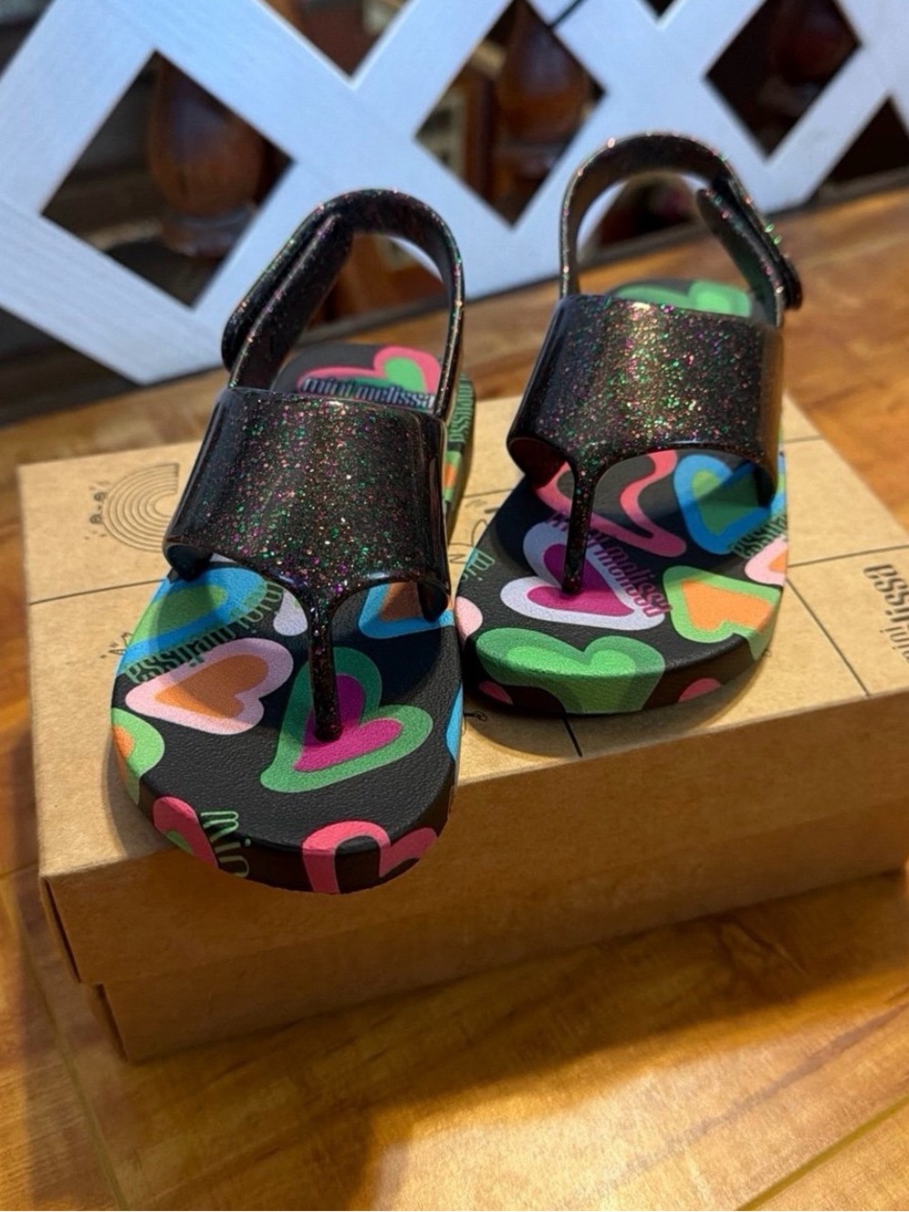 Mini Melissa Glitter T-Strap Sandals in Black with Colorful Heart Footbed